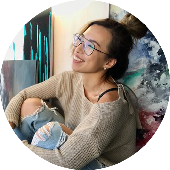 TheStoryBoxes Partnerships Manager, Joey Chan sitting in digital studio.